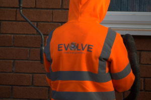 Filling the wall. Evolve Logo printed on shirt.
